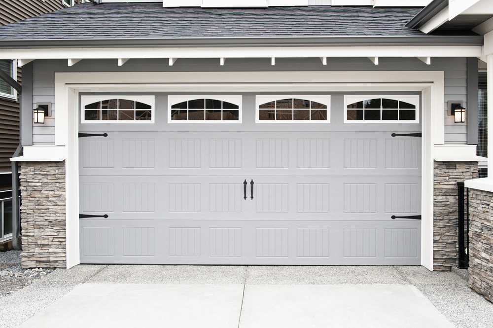 premium garage door with windows in suburban home